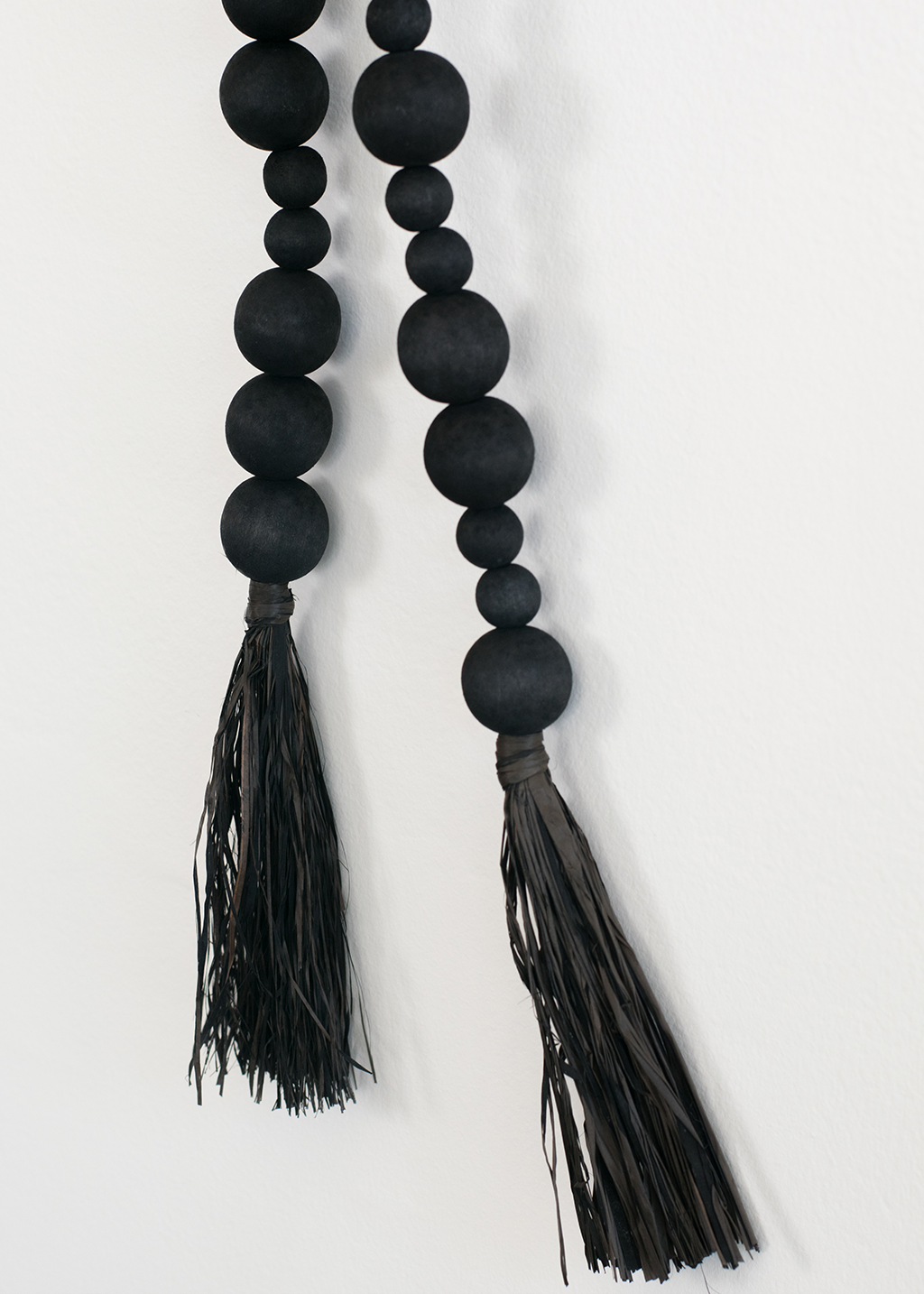 45" Black Acacia Wood Bead & Tassle Garland